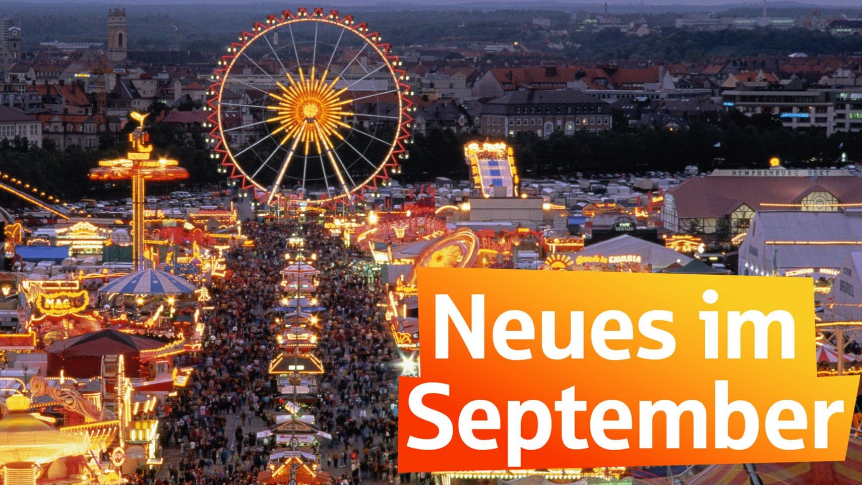 Blick von oben auf das beleuchtete Oktoberfest in München mit Riesenrad, Fahrgeschäften und Menschenmengen bei Abenddämmerung. Text „Neues im September"