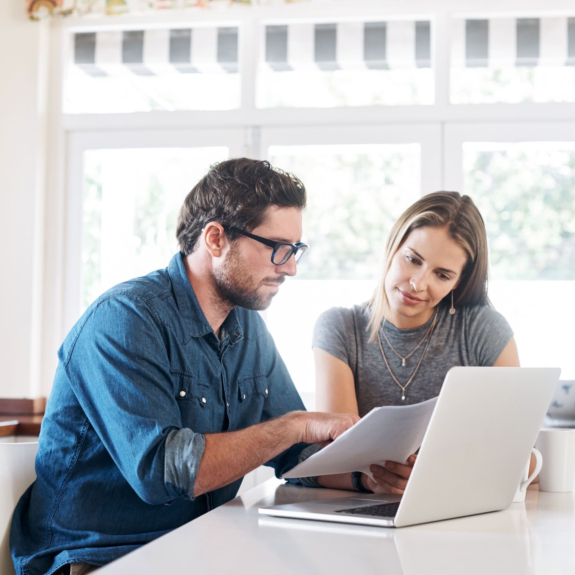 Shot of a young couple working on their finances together at home