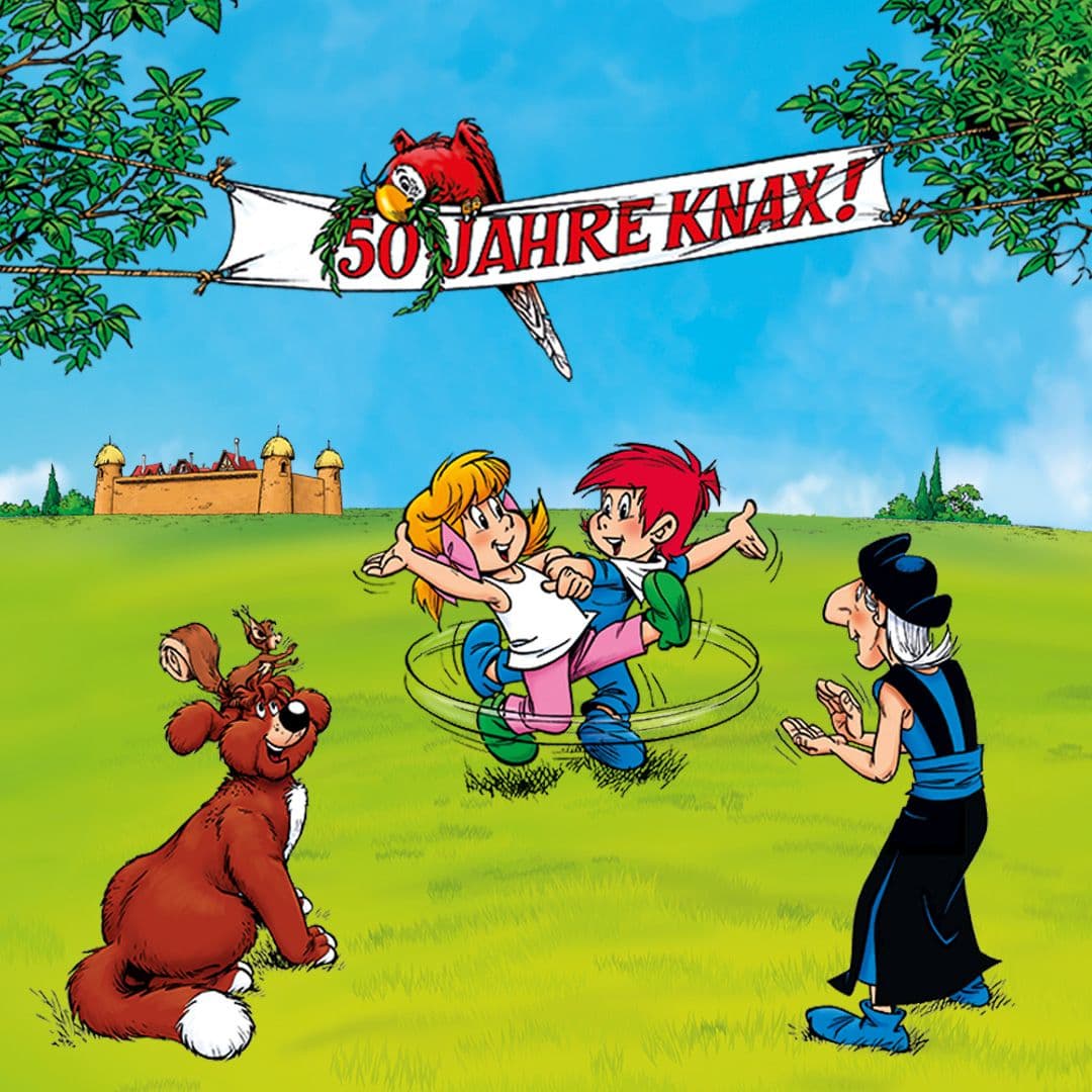 Knax-Charaktere feiern. Über ihnen hängt ein Banner mit der Aufschrift "50 Jahre Knax".