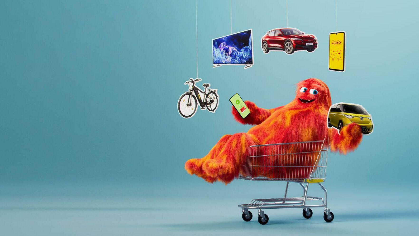 Gewinnspiel-Kampagnenbild zeigt ein Monster im Einkaufswagen, welches mit Gewinnen jongliert