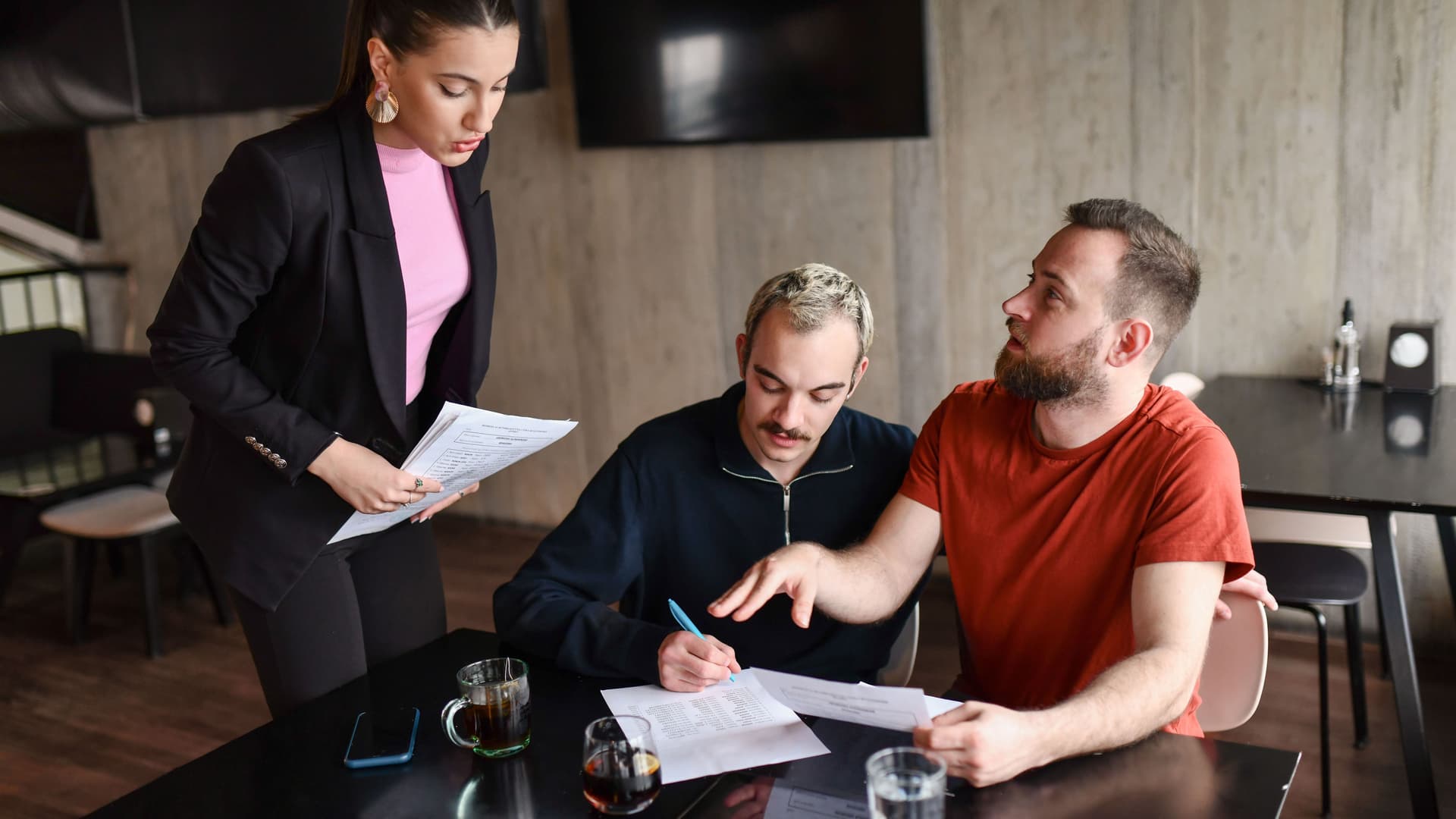 Female Lawyer Helping Gay Couple Settle Their Inheritance Documents