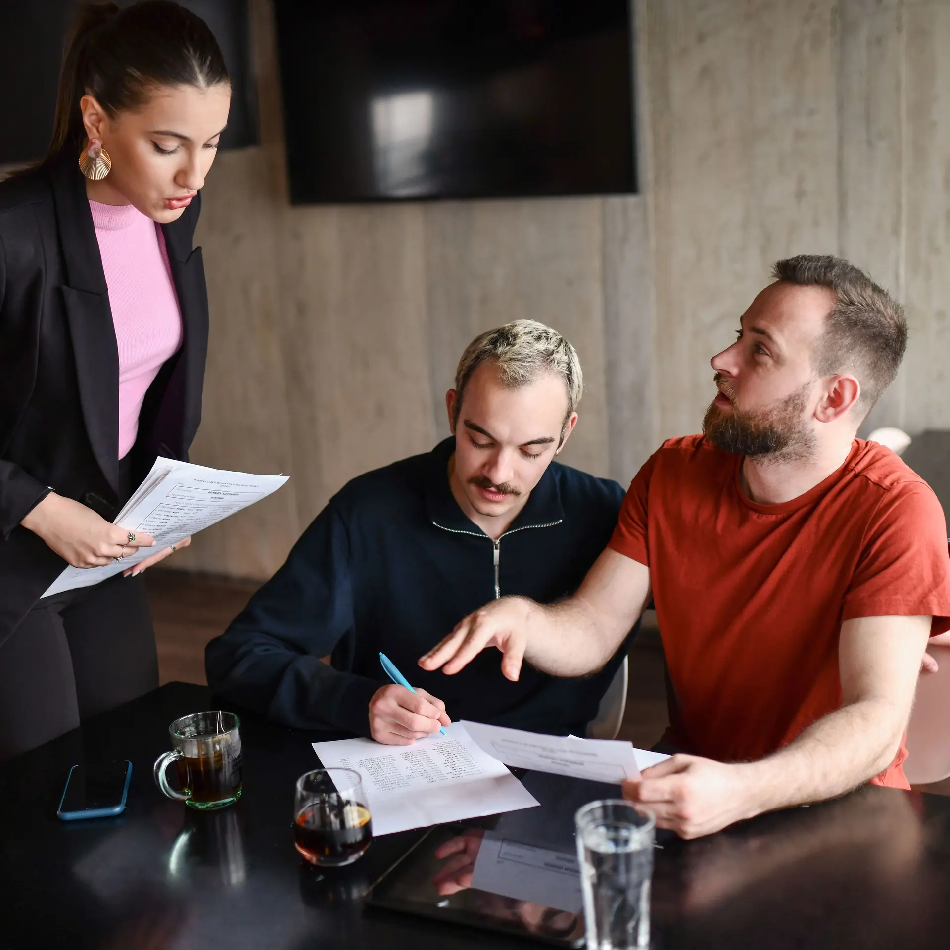 Female Lawyer Helping Gay Couple Settle Their Inheritance Documents